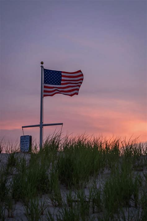 Sunset Flag Beach Dune Lavallette Nj Photograph by Terry DeLuco