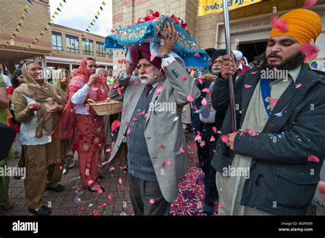 The Guru Granth Sahib Is Showered With Flower Petals As It Is Carried