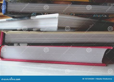 Books on the white desk. stock photo. Image of background - 107244284