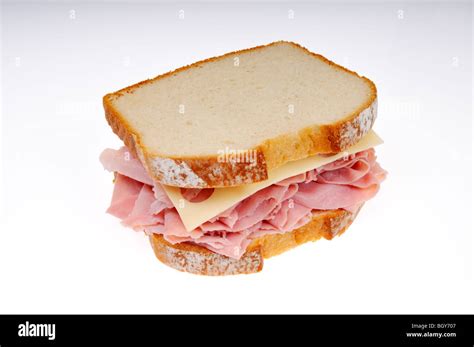 Ham And Swiss Cheese Sandwich On White Bread On White Background Cut