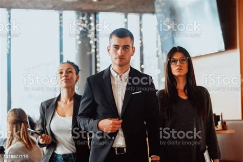 Group Of Successful Business People Standing Together At Modern