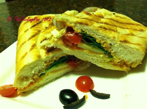 The Sizzling Pan Mediterranean Panini With Roasted Red Pepper Hummus Veggies And Feta Cheese