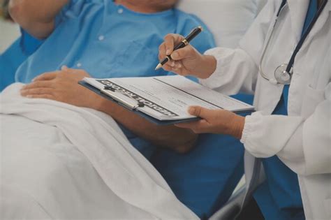 Premium Photo | Close up of female doctor using stethoscope putting ...