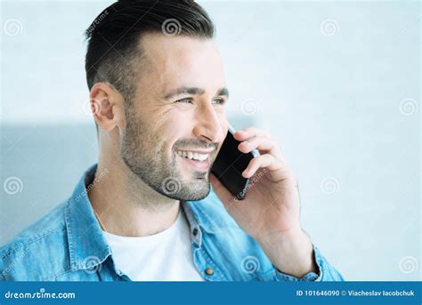 Radiant Young Man Talking On Phone And Smiling Stock Photo Image Of