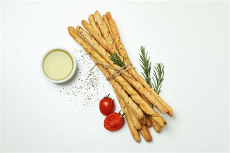 Premium Photo Grissini Breadsticks With Spices On White Background