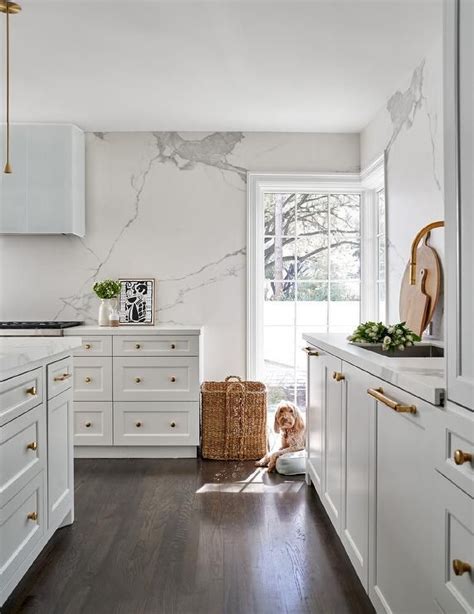 White Kitchen with Marble Countertops