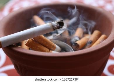 Hand Putting Out Butt On Cigarettes Stock Photo Shutterstock