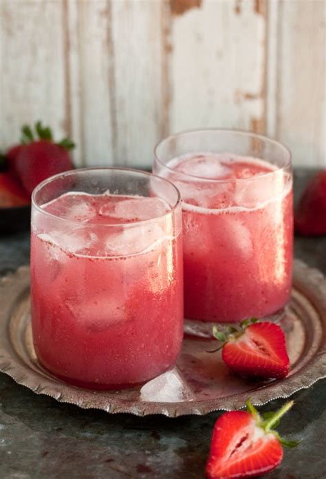 A Cocktail With Strawberries And Coconut Water Recipe