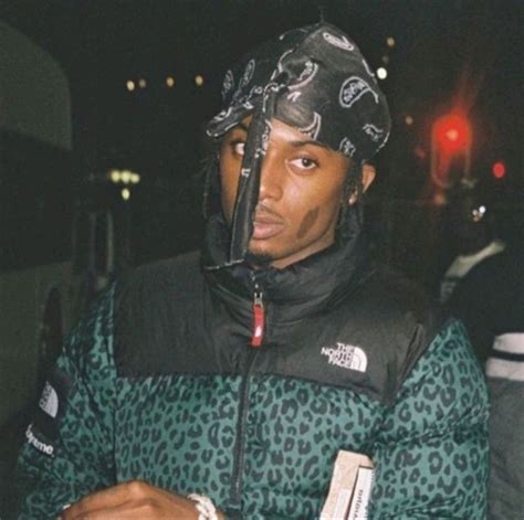 Playboi Carti Wearing A Durag And A North Face Leopard Puffer Jacket