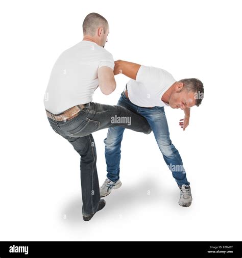 Man Defending An Attack From Another Man Selfdefense Kicking In Groin Isolated On White Stock