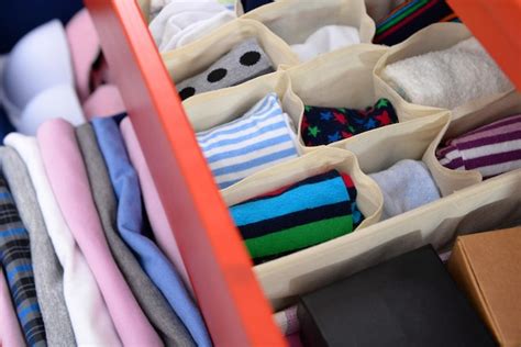 Premium Photo | Folded clothes in chest of drawers closeup