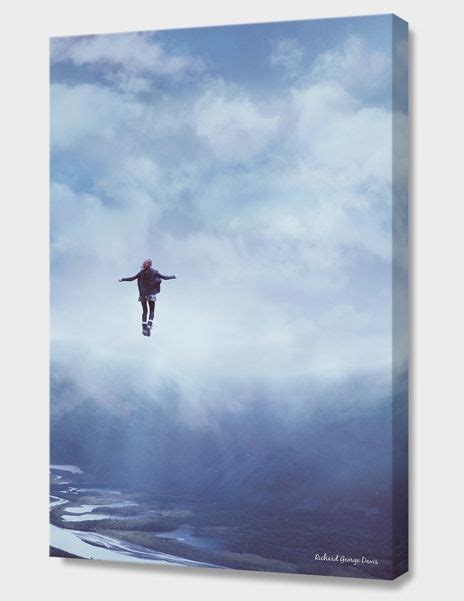 A Man Flying Through The Air On Top Of A Snow Covered Ski Slope Next To