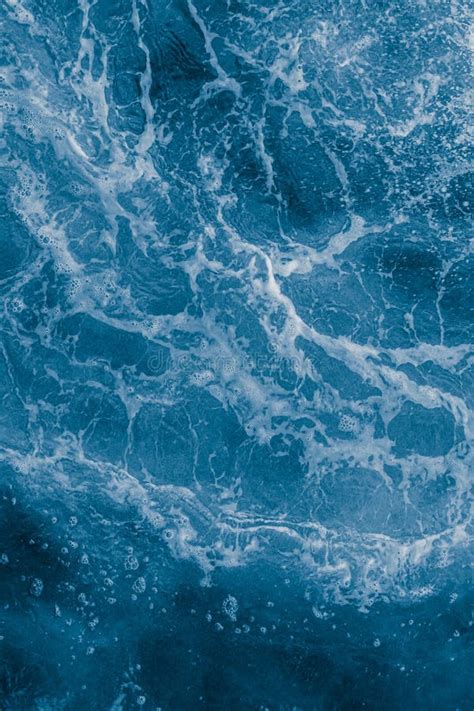 Dark Blue Sea Surface With Waves Splash And Bubbles Stock Photo