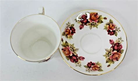 QUEEN ANNE BURGUNDY AND PINK ROSES BONE CHINA TEACUP AND SAUCER ENGLAND