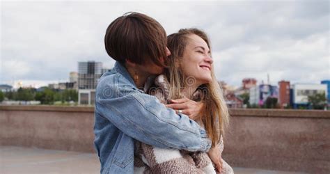 Two Lesbian Women Sit On The Embankment And Enjoy Each Other One Woman Massages Her Girlfriend