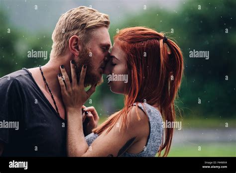 Two People Kissing In The Rain