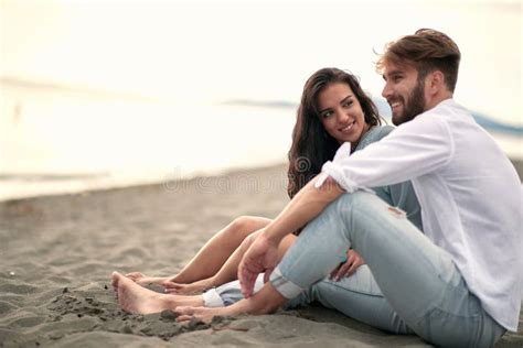 Young Man And Woman In Love Having Romantic Tender Moments On The Beach