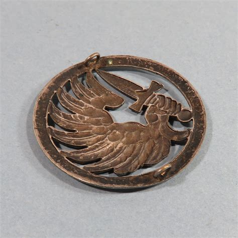 INSIGNE DE BERET PARACHUTISTE FABRICATION MOURGEON ANNEES 1950 TAP