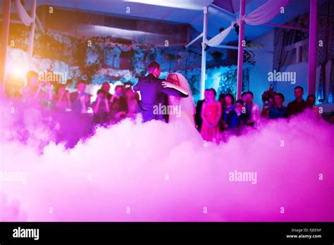 Amazing First Wedding Dance Of Newlyweds On Low Pink Light And Heavy