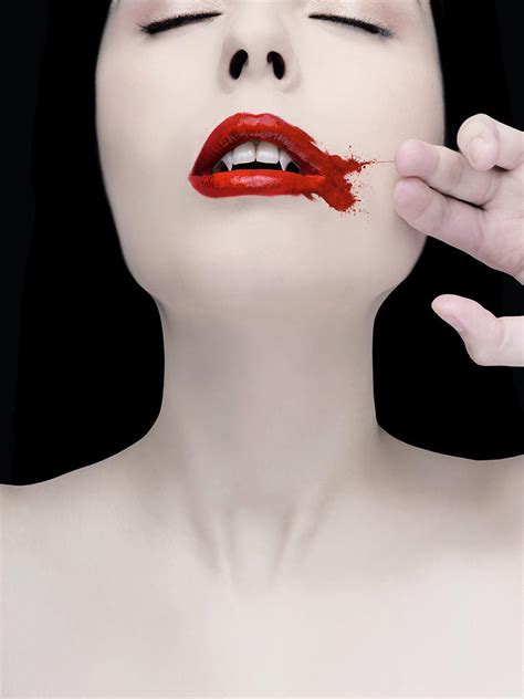 A Vampire Wiping Blood From Her Mouth By Colin Anderson