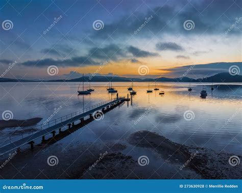 Soft And Hazy Aerial Sunrise Waterscape With Boats Stock Photo Image