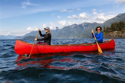 Adventurous Girls Canoeing In Howe Sound Stock Photo Image Of Scenic