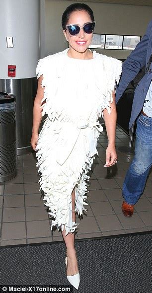 Lady Gaga wears simple white feather dress after Meta Gala outfit ...