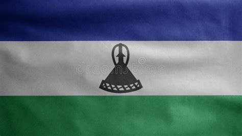 Bandera Que Agita De Lesotho Contra El Cielo Azul Con Rayos Solares