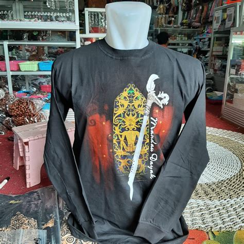 Jual Baju Kaos Motif Suku Dayak Motif Mandau Tameng Kalimantan Khas