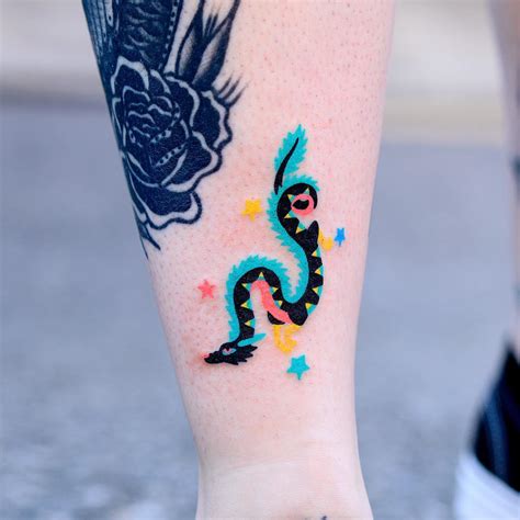 Hand holding knife tattoo - Tattoogrid.net