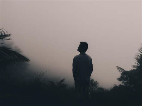 Premium Photo Rear View Of Man Standing Against Sky