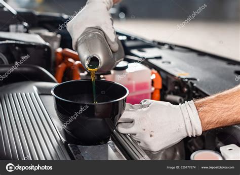 Cropped View Mechanic Pouring Oil Car Engine Stock Photo