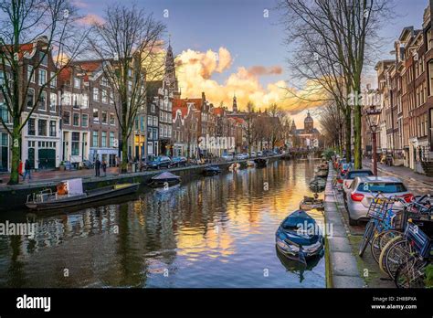 Downtown Amsterdam city skyline. Cityscape in Netherlands at sunset ...