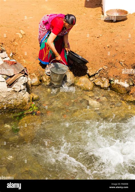 Indian Woman Washing Clothes At The Canal Pawalgarh Uttarakhand