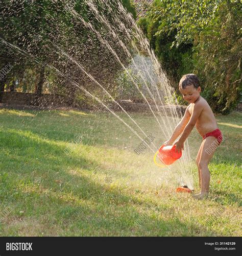 Water Sprinkler Fun Image & Photo (Free Trial) | Bigstock