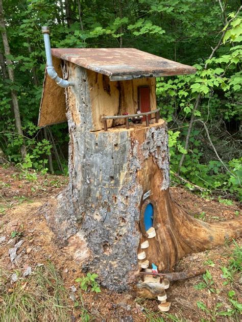 A Tree Stump With A House Built Into It