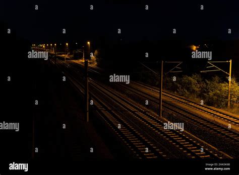 Train Tracks With Train At Night