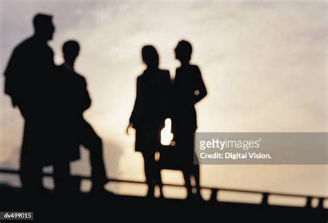 3,393 Four People Silhouette Stock Photos, High-Res Pictures, and ...