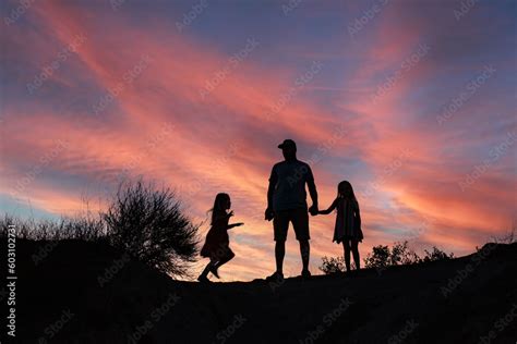 Holding Hands at Sunset Stock Photo | Adobe Stock