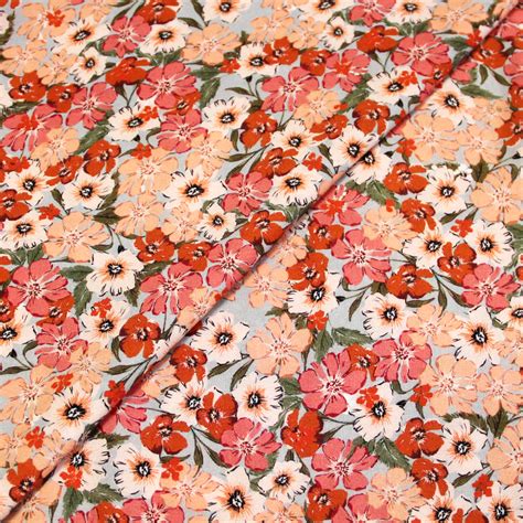 Toile de viscose Fleuri rose orange fond ciel vendu au mètre