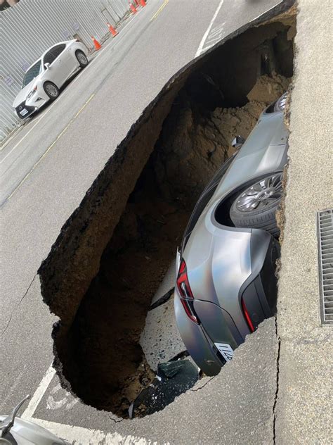 Watch The Moment A Sinkhole Swallows Tesla Model Y