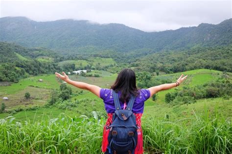 Premium Photo Asian Woman With Backpack Is Spread Arms Freedom Life