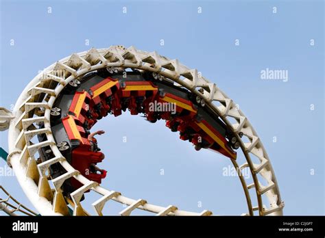 Riders Enjoying Exhilarating Roller Coaster White Knuckle Fairground