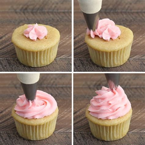 The Cupcakes Are Being Frosted With Pink Icing And Then Topped With A Piping Tool