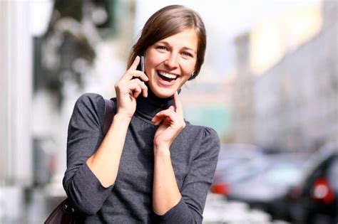 Premium Photo Young Beautiful Woman Talking On Cell Phone