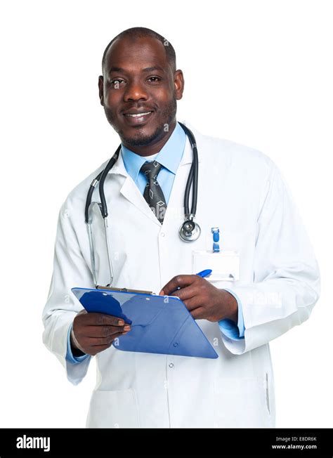 Portrait Of A Smiling Male Doctor Writing In The Notepad On White