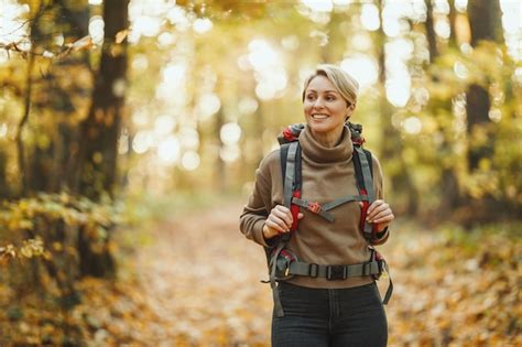 Premium Photo Shot Of A Mature Woman Walking Through The Forest In