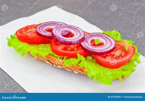 Healthy Eating Fresh Sandwich With Lettuce Tomato And Onion On Stock