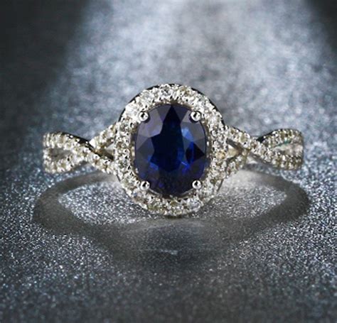 2 Carat Oval Cut Blue Sapphire And Diamond Halo Engagement Ring In