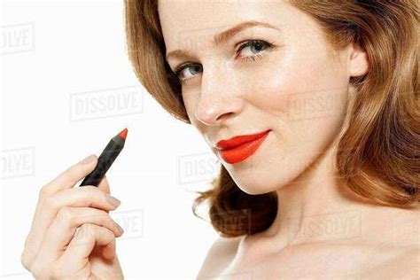 Woman Holding Red Lipstick Stock Photo Dissolve